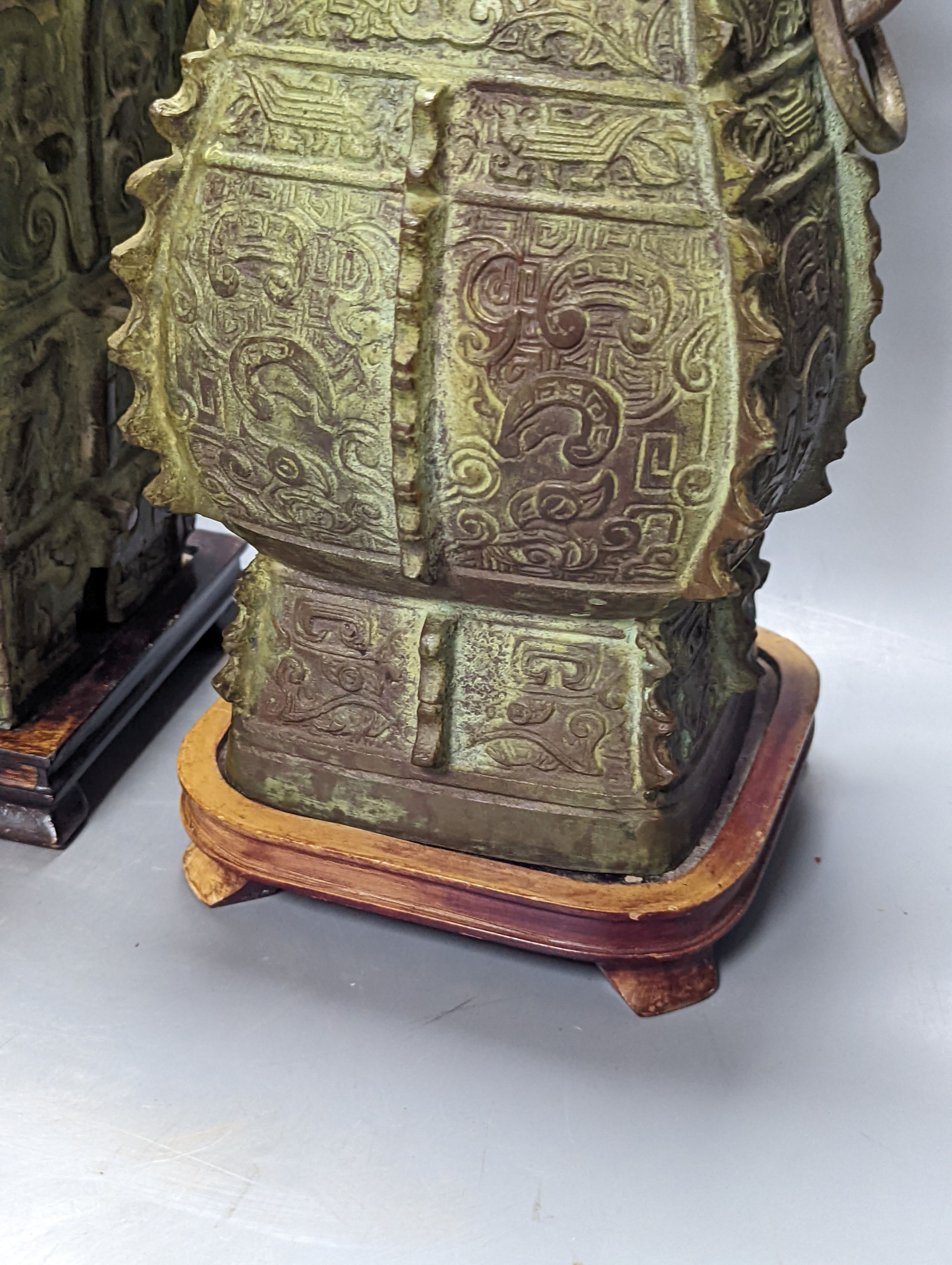 Two Chinese archaic style bronze lamp bases, 38 cm high to top of fitting